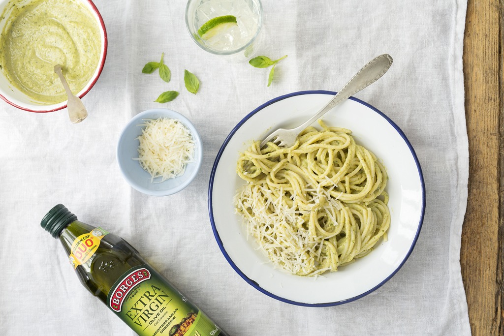 A dish of spaguetti with pesto sauce, parmesan cheese and Borges olive oil