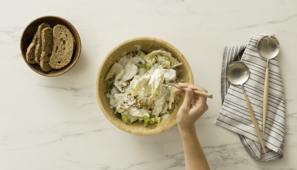 Easy caesar salad recipe served in a wooden bowl