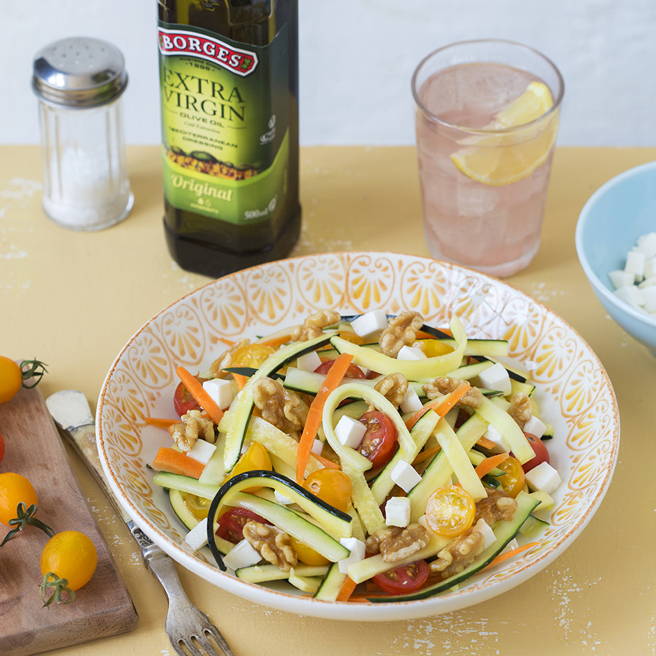 Zucchini salad served in a bowl with Borges extra virgin olive oil